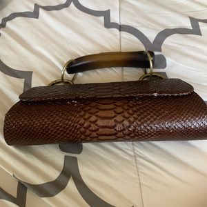 Faux snake skin clutch